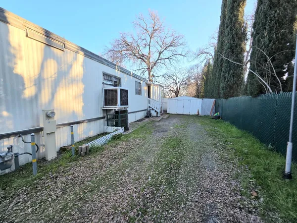 a view of a back yard of the house
