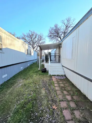 a view of a yard with an outdoor space