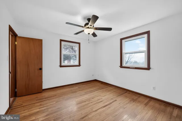 a bathroom with a toilet and a shower curtain