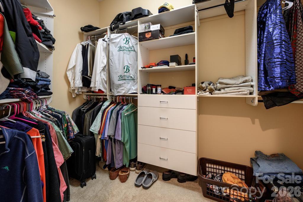 7315 Bay Ridge Drive Denver, NC 28037 - Photo 35 of 39 a view of walk in closet with clothes and shoes