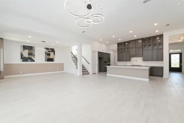 a view of a kitchen with a sink stainless steel appliances and cabinets