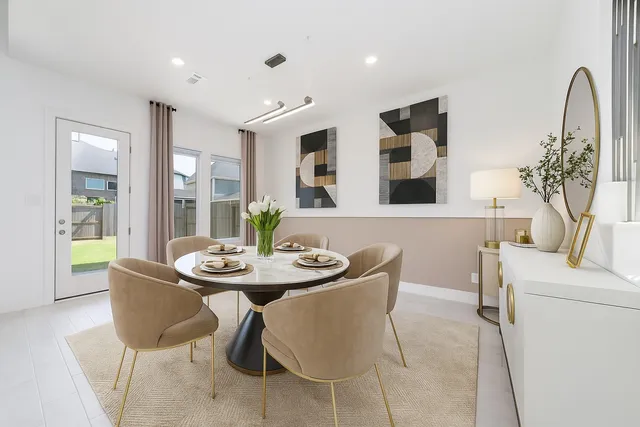a dining room with furniture and window