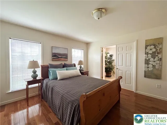 a bed room with a bed and a window