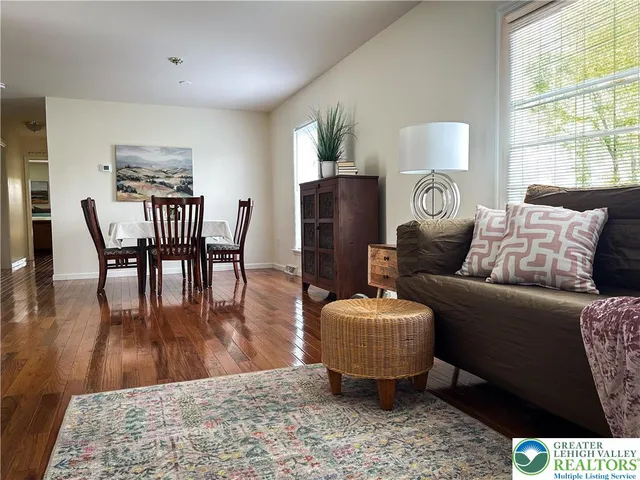 a living room with furniture and a table