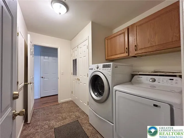 a utility room with dryer and washer
