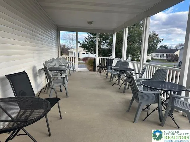 a living room with furniture and a bed