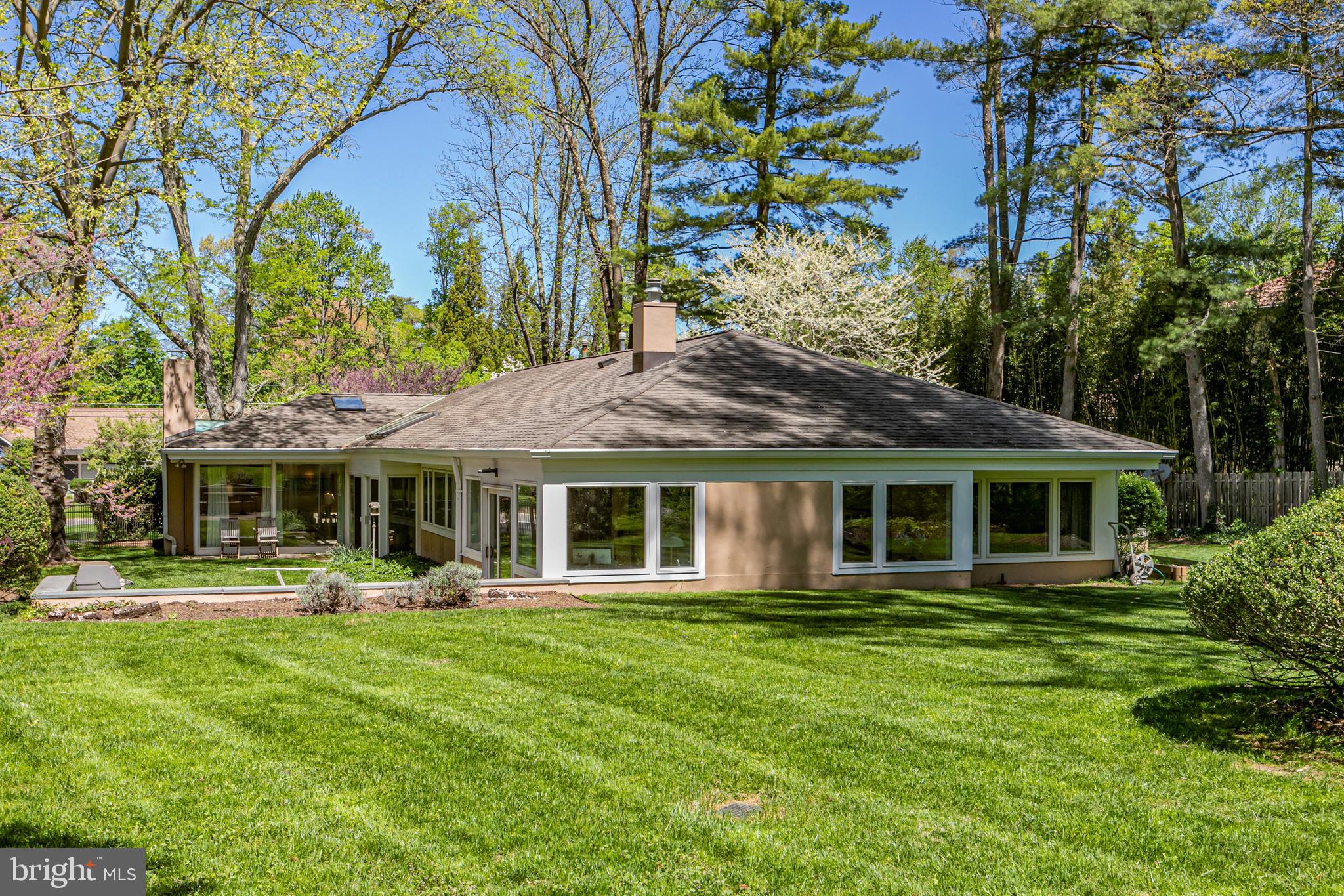 74 Wilson Road Princeton, NJ 08540 - Photo 28 of 43 a front view of a house with a yard table and chairs