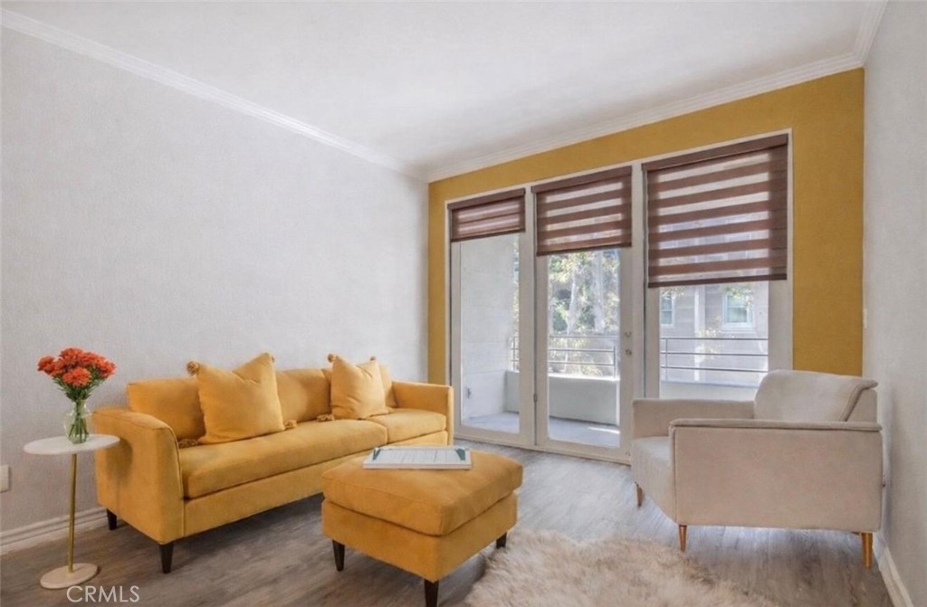 2233 Martin, Unit 108 Irvine, CA 92612 - Photo 6 of 31 a living room with furniture and a large window