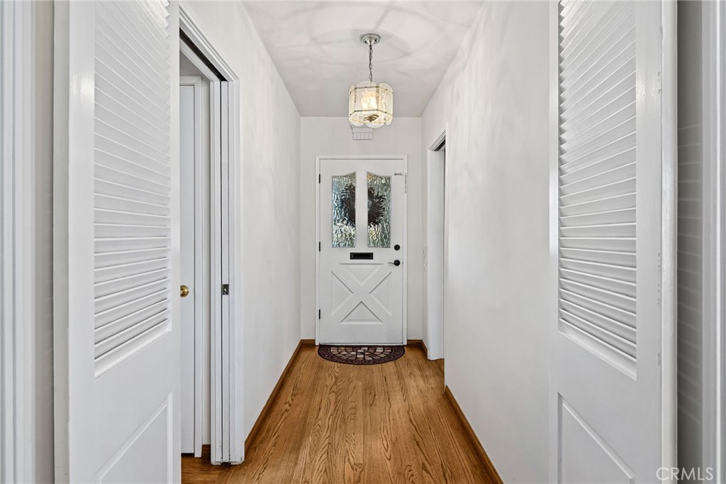 222 South Wagonwheel Road Glendora, CA 91741 - Photo 17 of 70 a view of a hallway with wooden floor and staircase