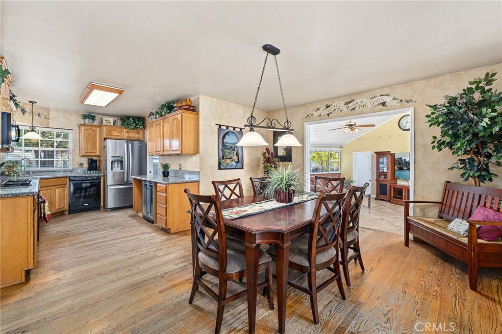 222 South Wagonwheel Road Glendora, CA 91741 - Photo 22 of 70 a view of a dining room with furniture and wooden floor