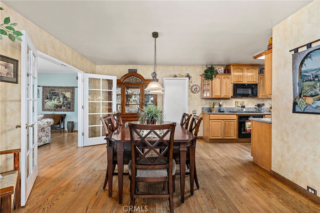 222 South Wagonwheel Road Glendora, CA 91741 - Photo 23 of 70 a dining room with furniture and wooden floor