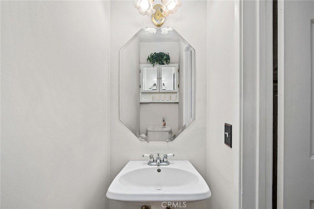 222 South Wagonwheel Road Glendora, CA 91741 - Photo 30 of 70 a bathroom with a sink and a mirror