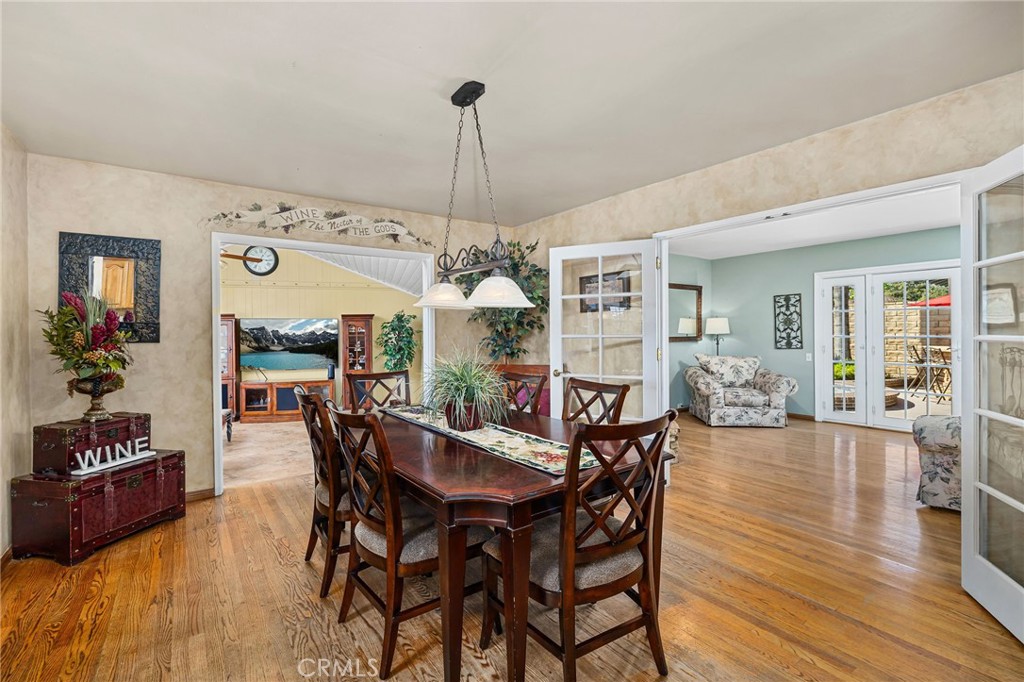 222 South Wagonwheel Road Glendora, CA 91741 - Photo 32 of 70 a view of a dining room with furniture wooden floor and chandelier