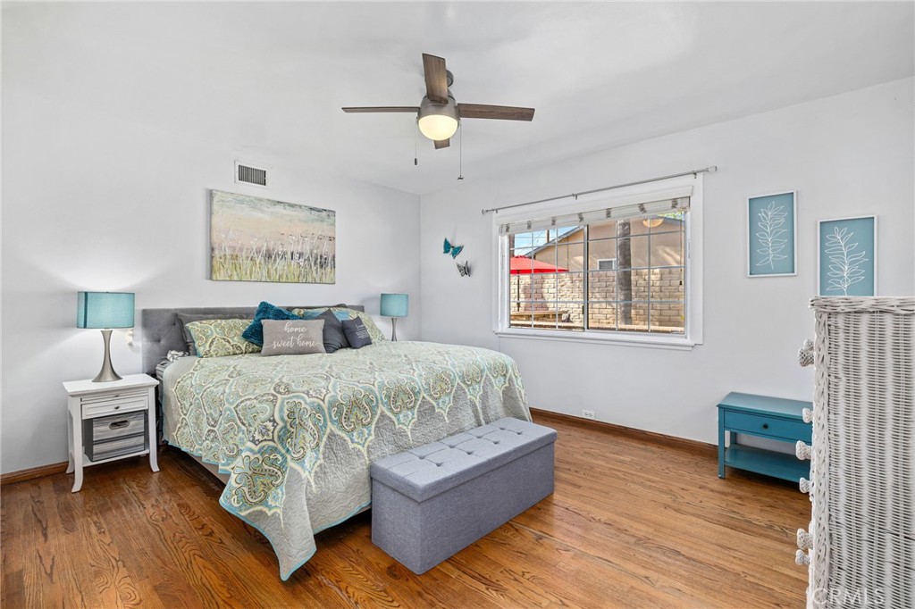 222 South Wagonwheel Road Glendora, CA 91741 - Photo 38 of 70 a spacious bedroom with a bed a couch and a window