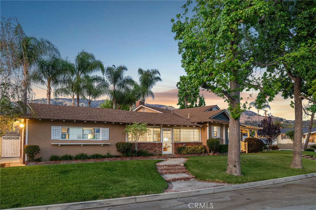 222 South Wagonwheel Road Glendora, CA 91741 - Photo 8 of 70 a front view of a house with a garden
