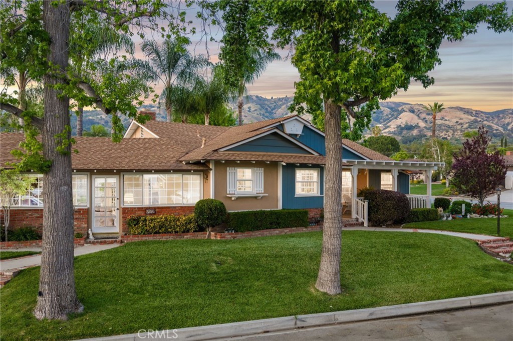222 South Wagonwheel Road Glendora, CA 91741 - Photo 10 of 70 a front view of a house with a yard and green space