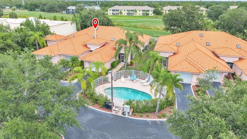 1260 Rio De Janeiro Avenue, Unit 102 Punta Gorda, FL 33983 - Photo 2 of 46 an aerial view of a house with outdoor space and lake view