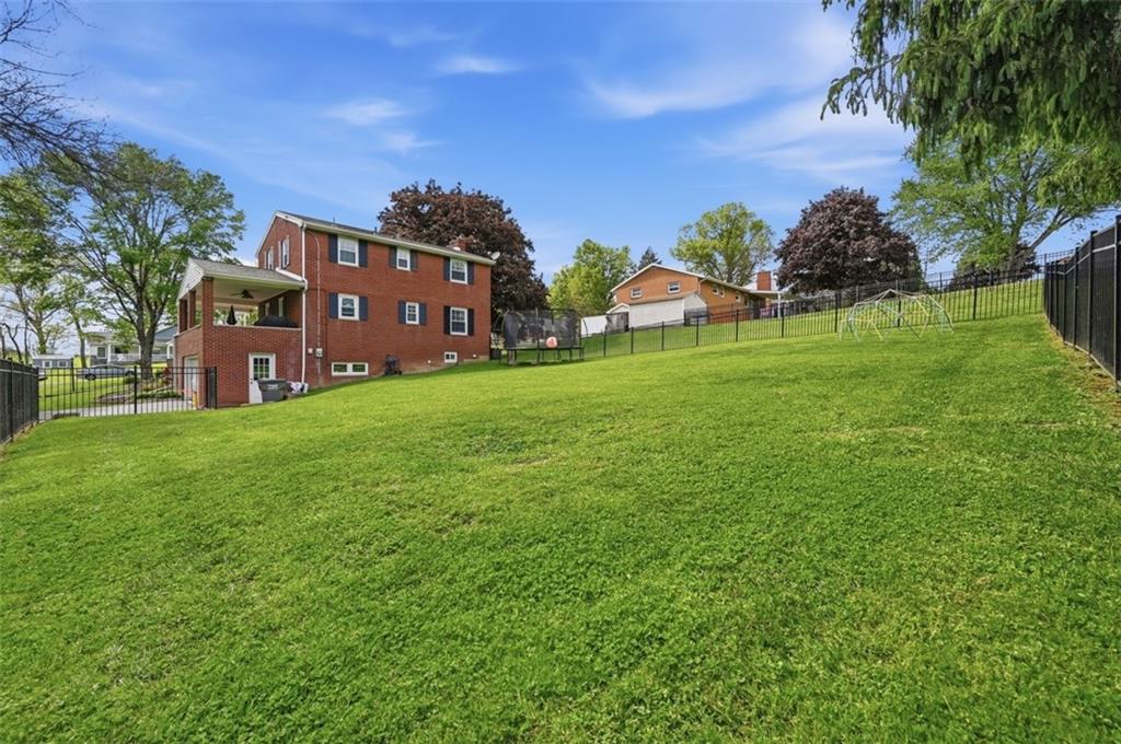 129 Meadowbrook Road Renfrew, PA 16053 - Photo 32 of 45 a view of a house with a big yard and large trees