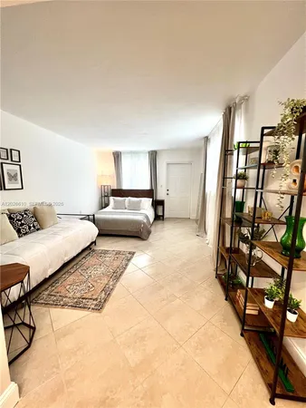 a bedroom with a bed and a night stand