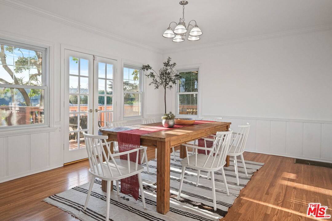 2000 Ridgeview Avenue Los Angeles, CA 90041 - Photo 11 of 50 a view of a dining room with furniture a chandelier and wooden floor