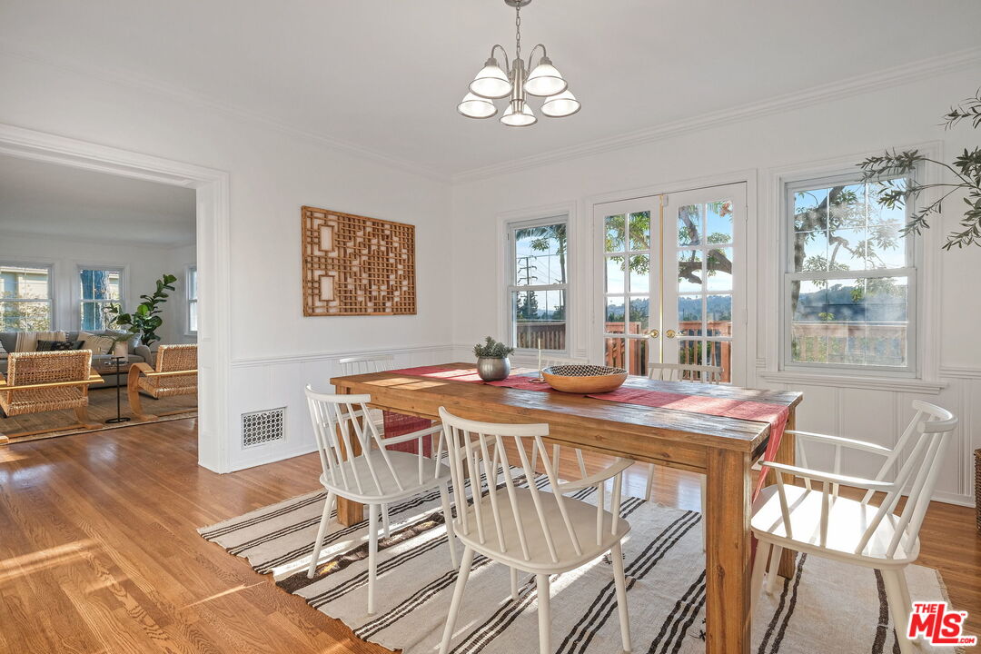 2000 Ridgeview Avenue Los Angeles, CA 90041 - Photo 12 of 50 a view of a dining room with furniture wooden floor and chandelier