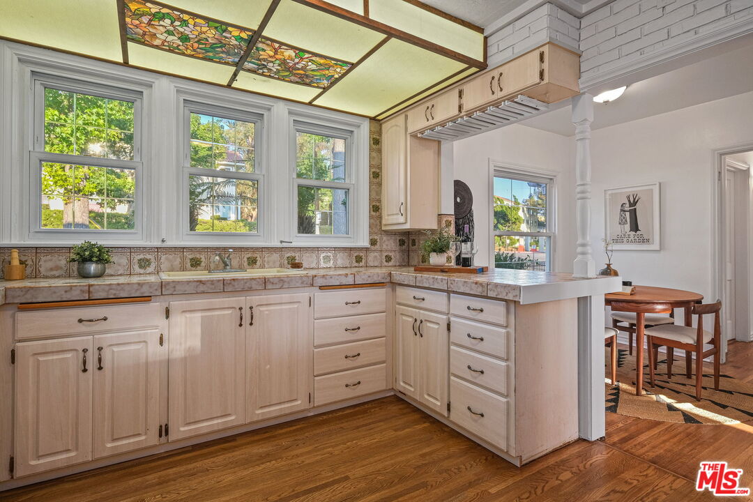 2000 Ridgeview Avenue Los Angeles, CA 90041 - Photo 17 of 50 a kitchen with sink cabinets and wooden floor