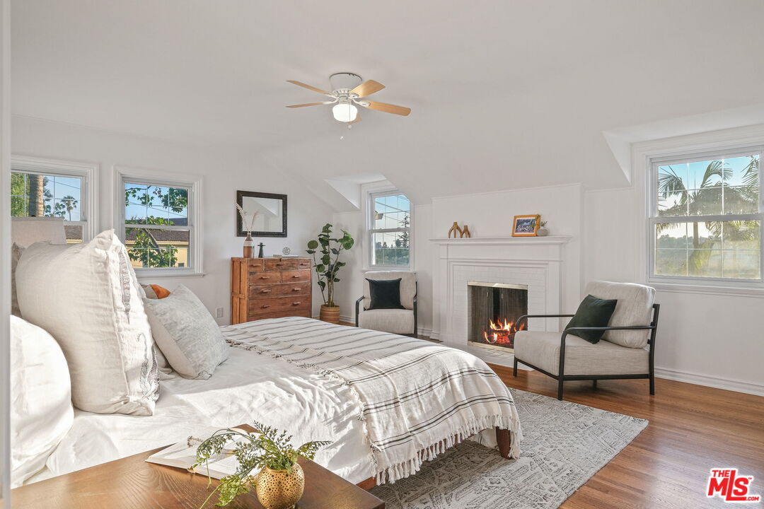2000 Ridgeview Avenue Los Angeles, CA 90041 - Photo 22 of 50 a bedroom with a bed and a fireplace