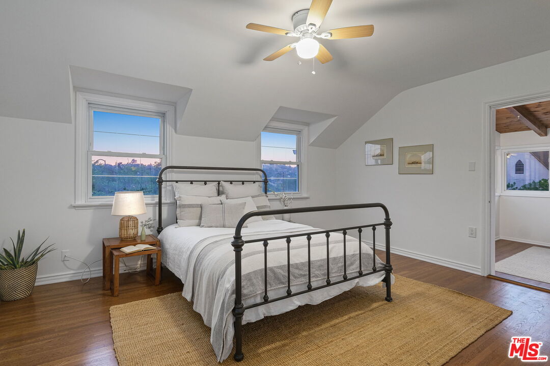 2000 Ridgeview Avenue Los Angeles, CA 90041 - Photo 25 of 50 a bedroom with a bed and wooden floor