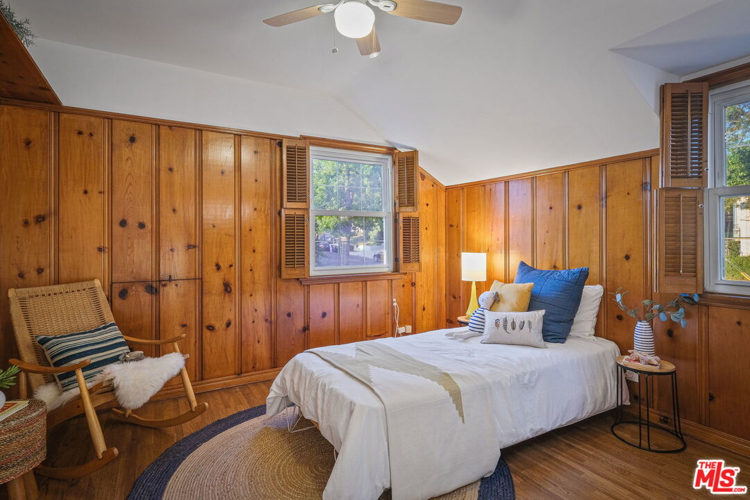 2000 Ridgeview Avenue Los Angeles, CA 90041 - Photo 28 of 50 a bedroom with a bed and wooden floor