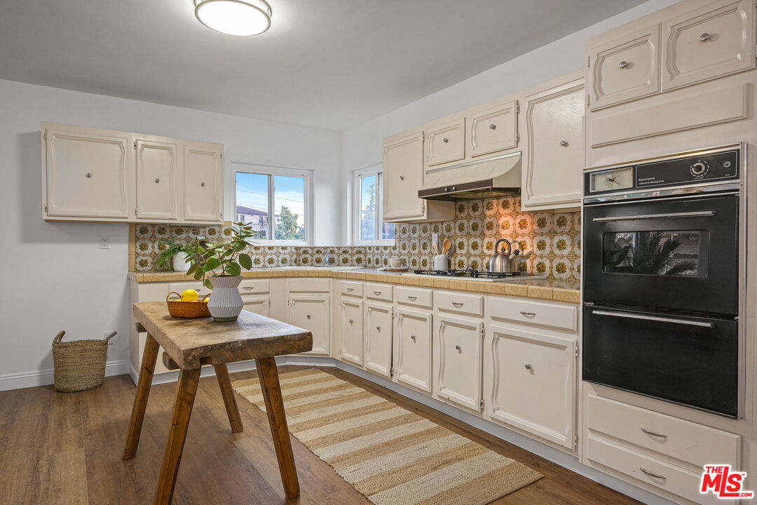 2000 Ridgeview Avenue Los Angeles, CA 90041 - Photo 39 of 50 a kitchen with white cabinets and appliances