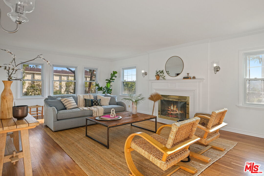 2000 Ridgeview Avenue Los Angeles, CA 90041 - Photo 7 of 50 a living room with furniture a fireplace and a floor to ceiling window