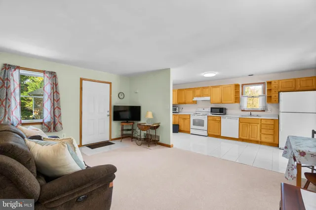 a kitchen with a stove a sink and a refrigerator