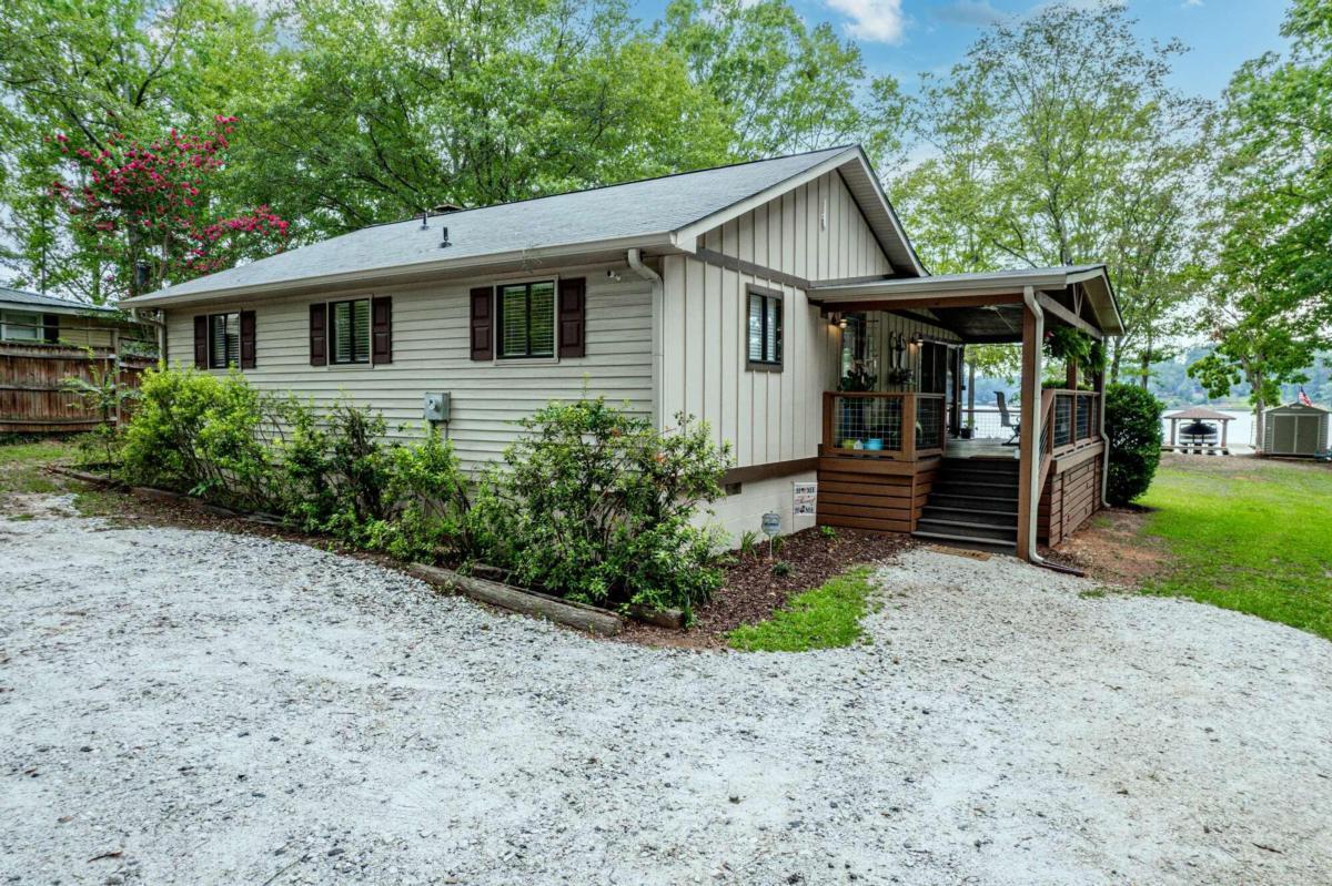 145 North Steel Bridge Road Eatonton, GA 31024 - Photo 1 of 1 a front view of a house with garden