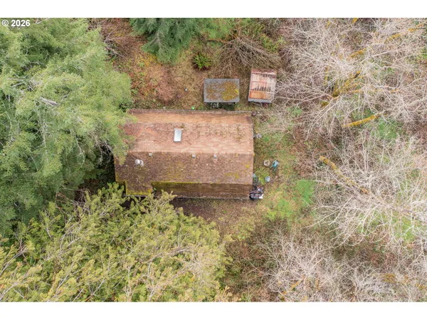 a aerial view of a house with a yard