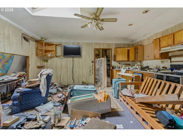 a living room with lots of furniture and a flat screen tv