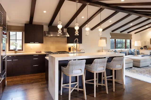 a bedroom with a large bed and a large window