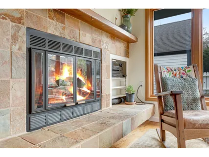 a view of a porch with a table and chairs and potted plants