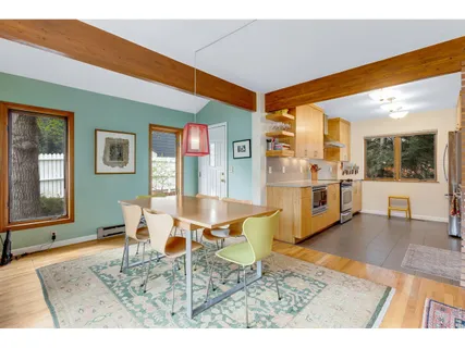 a living room with stainless steel appliances kitchen island granite countertop furniture and a kitchen view