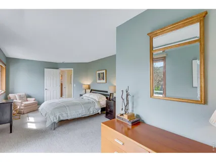 a bedroom with bed and window