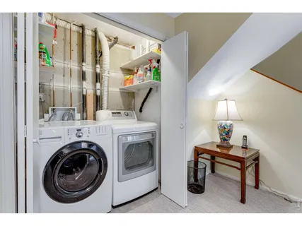 a view of livingroom with washer and dryer
