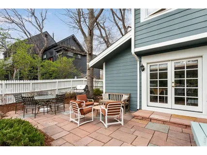 a balcony with table and chairs