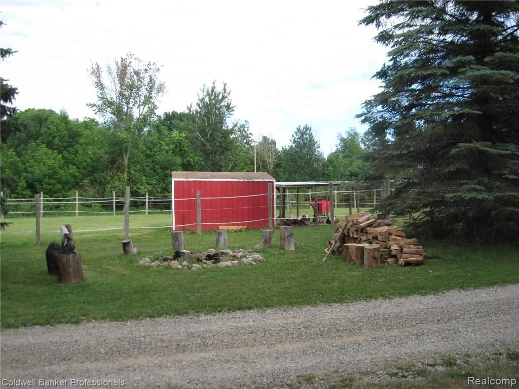 1430 West Brocker Road Metamora, MI 48455 - Photo 6 of 34 Great fire pit with lots of wood to toast those marshmellows