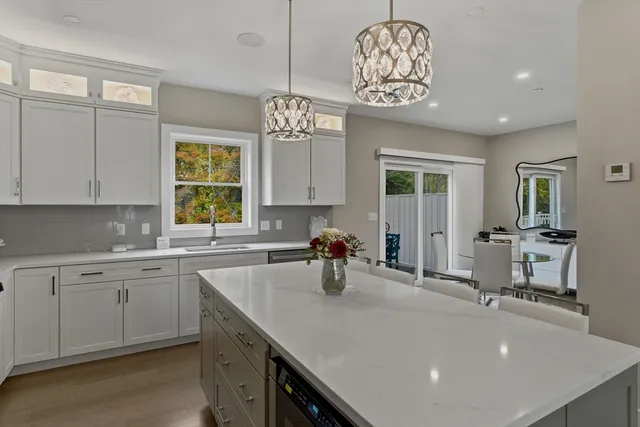 a kitchen with sink cabinets and window