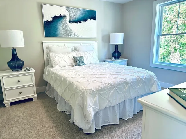 a bed room with a bed and a lamp