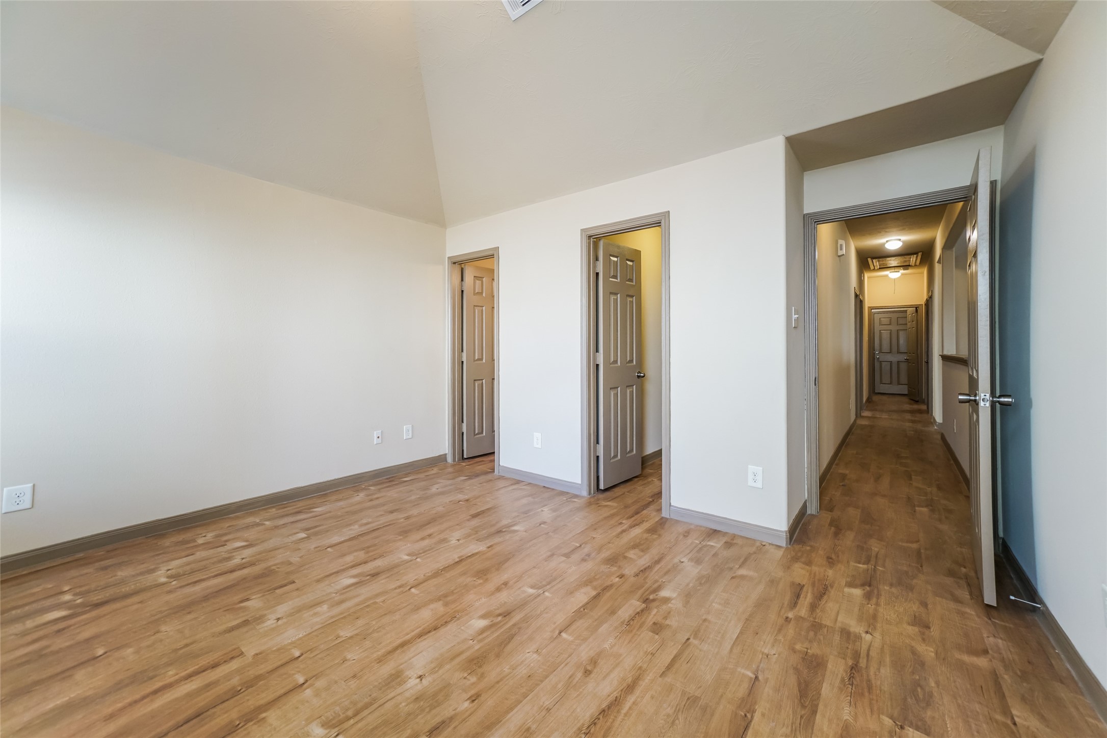 2450 Jonahs Way Houston, TX 77073 - Photo 7 of 13 a view of hallway with wooden floor