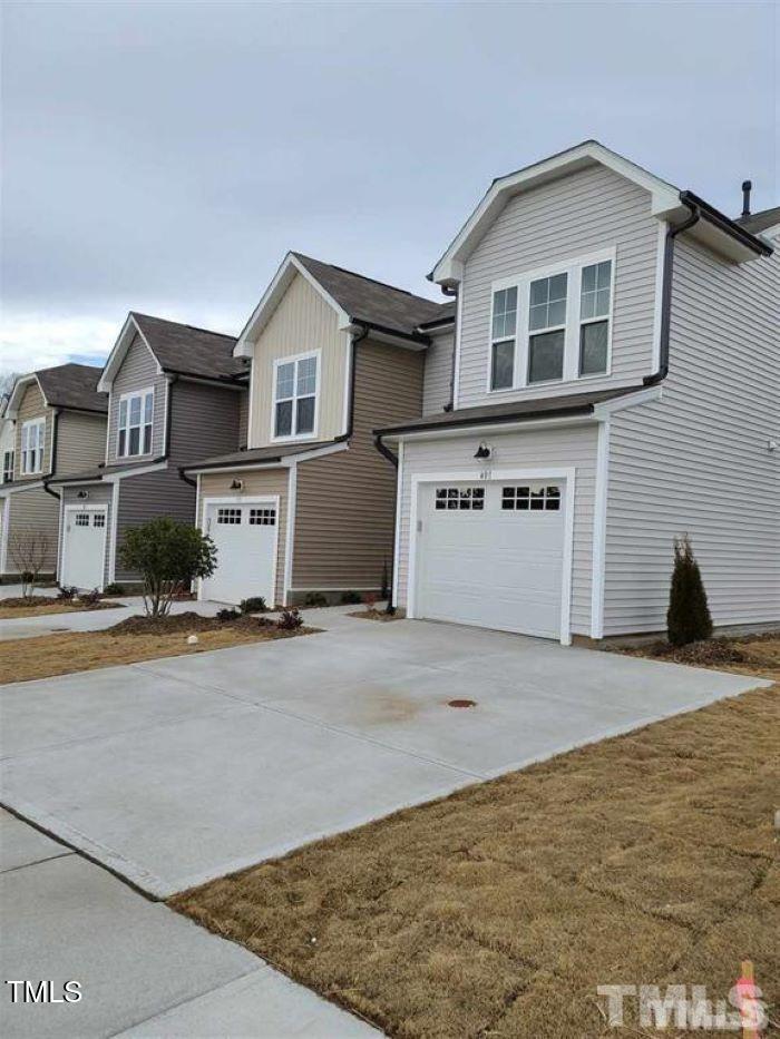 a view of a house with a street