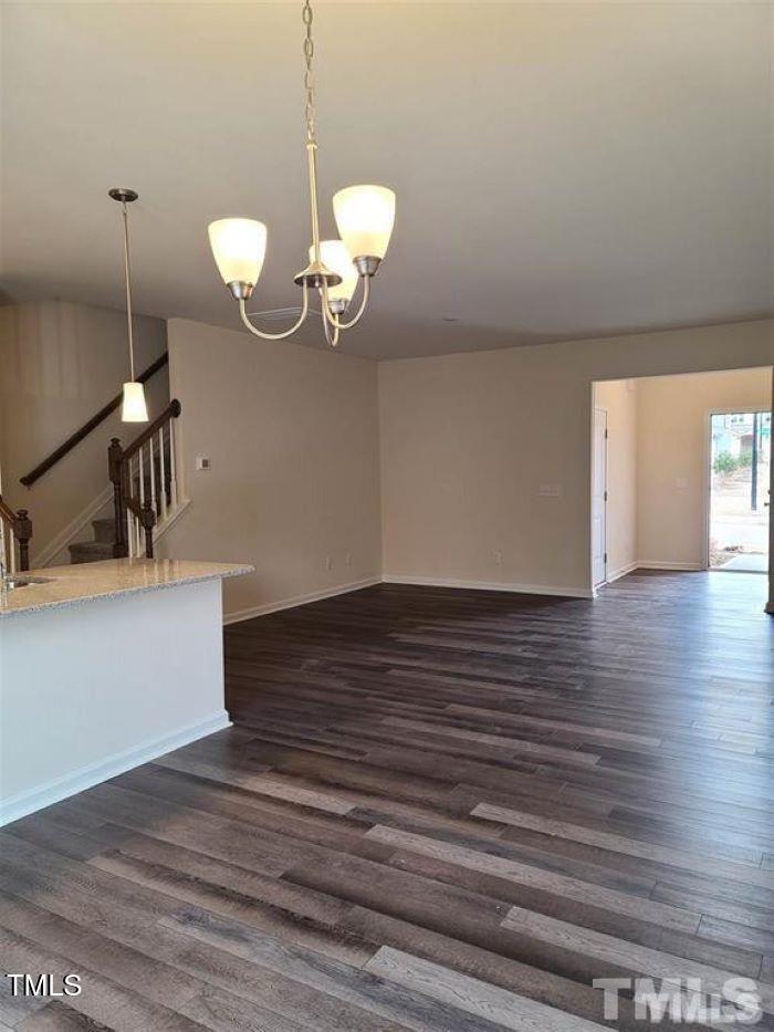 401 Purdue Drive Durham, NC 27713 - Photo 11 of 14 a view of a room with wooden floor and staircase