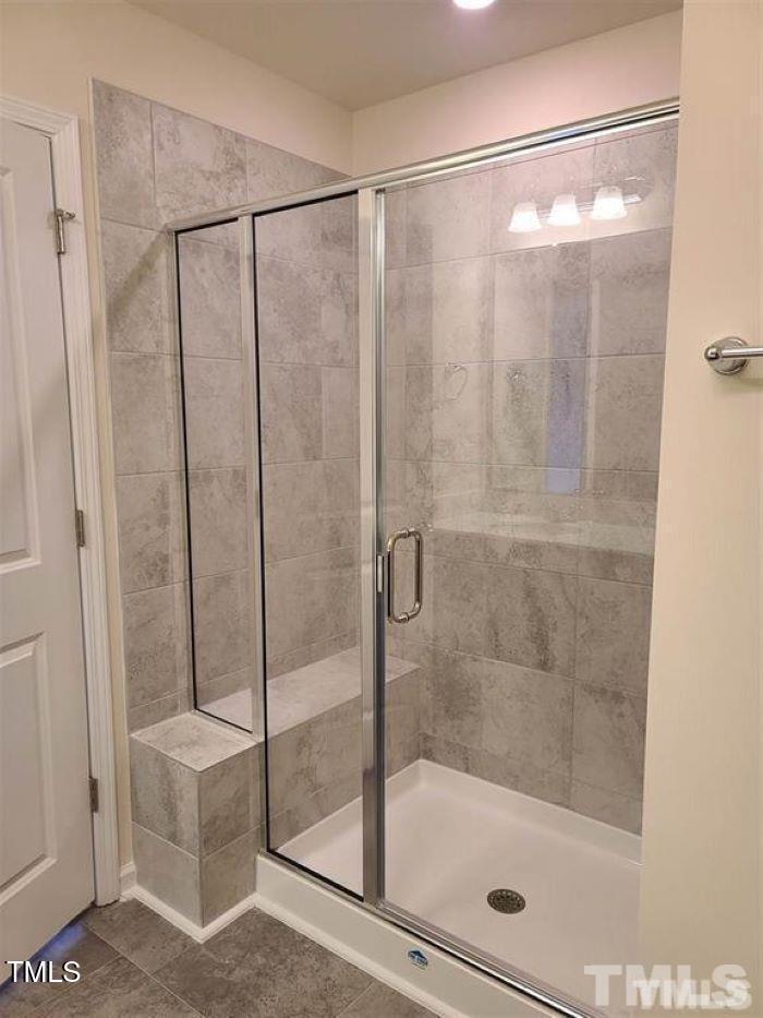 401 Purdue Drive Durham, NC 27713 - Photo 3 of 14 a bathroom with a glass shower door