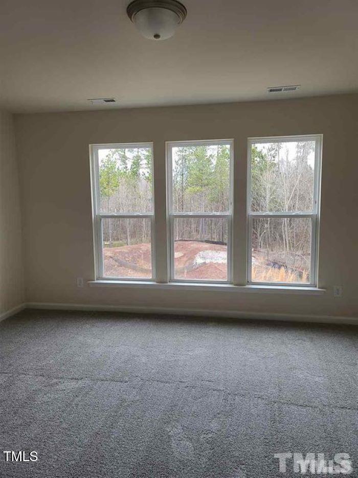 401 Purdue Drive Durham, NC 27713 - Photo 5 of 14 a view of an empty room with a window