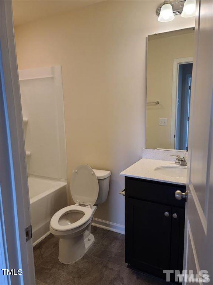 401 Purdue Drive Durham, NC 27713 - Photo 7 of 14 a bathroom with a toilet a sink and bathtub